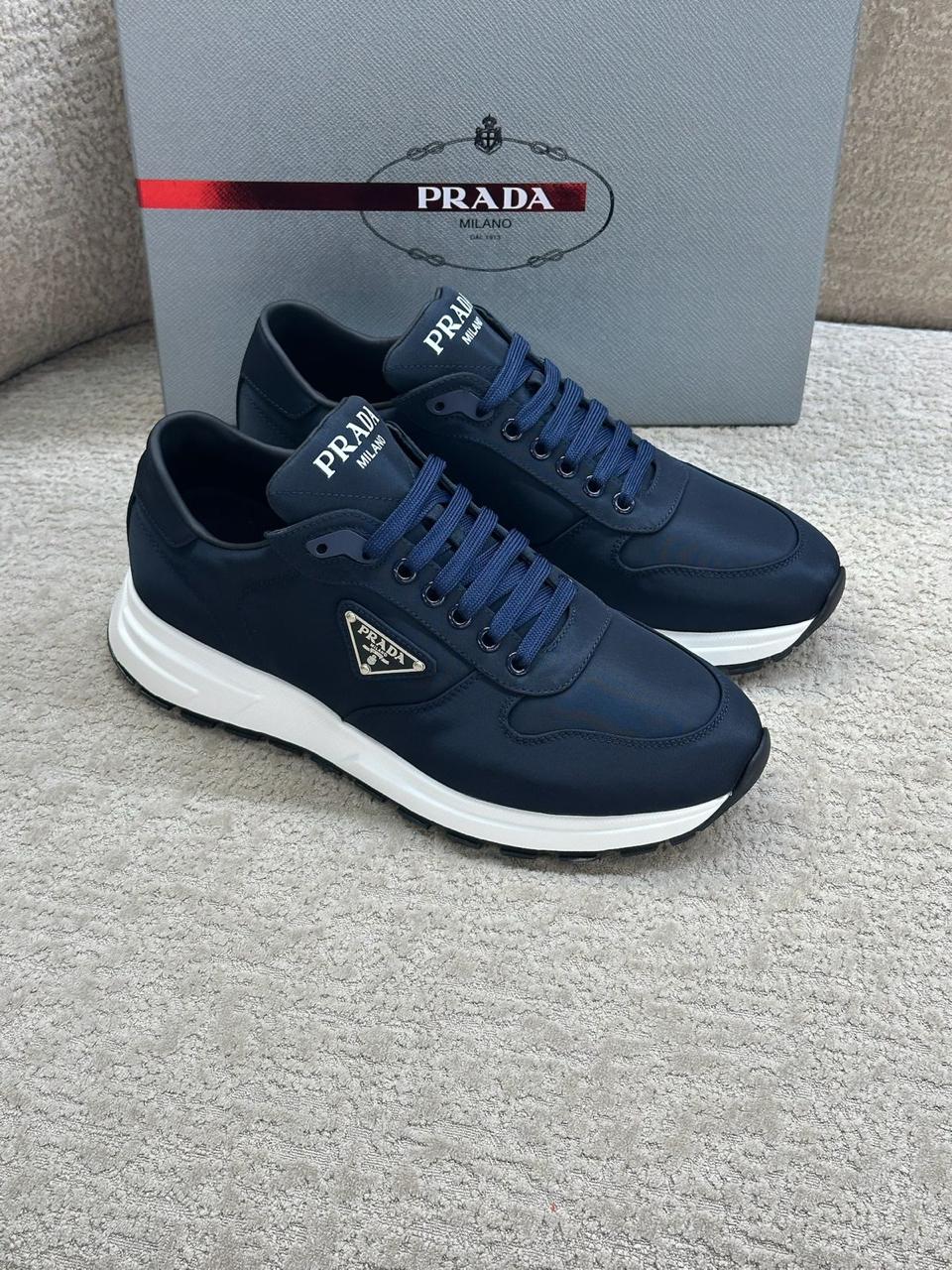 Prada Prax 01 Re-Nylon and Leather Sneakers in Navy Blue.