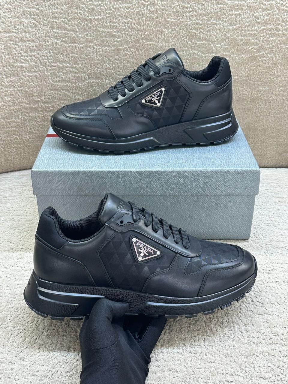 Prada Geometric-Pattern Panelled Sneakers (Black)
